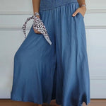 Sage flowy high-waist wide-leg pants shown in a relaxed, flattering silhouette