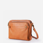 Kaya's Jewel full-grain leather shoulder bag shown in brown, blue, black and green