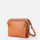 Kaya's Jewel full-grain leather shoulder bag shown in brown, blue, black and green