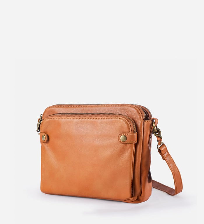Kaya's Jewel full-grain leather shoulder bag shown in brown, blue, black and green