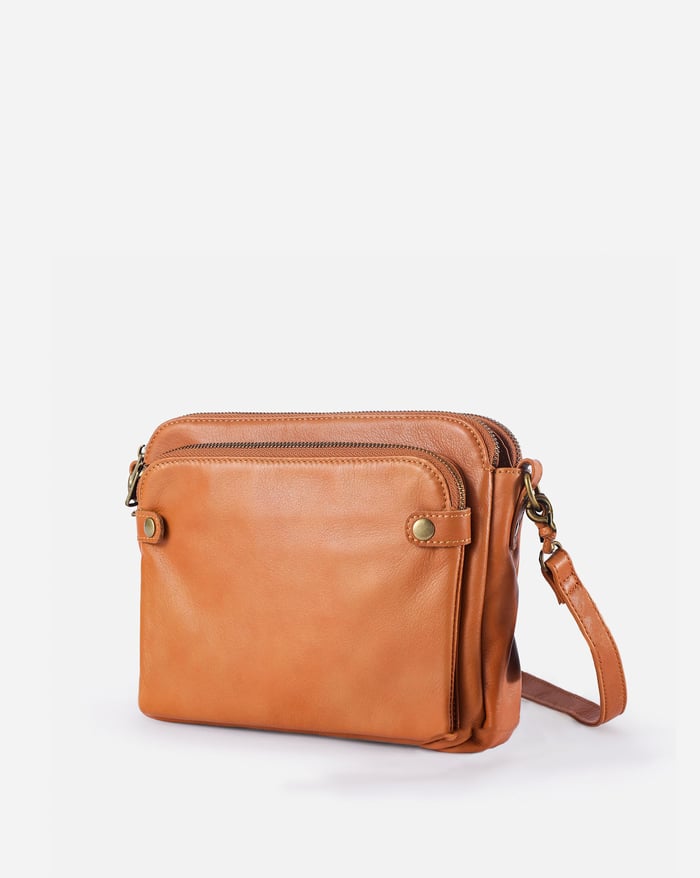 Kaya's Jewel full-grain leather shoulder bag shown in brown, blue, black and green