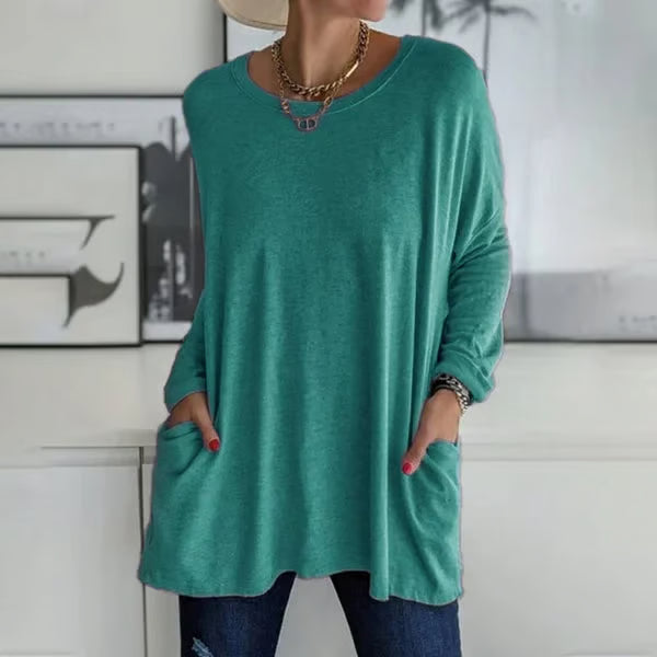Alondra everyday pocket top with loose fit and flared hem, shown in a neutral colour