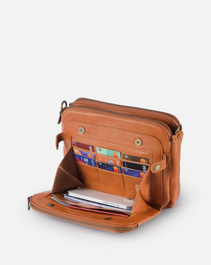 Kaya's Jewel full-grain leather shoulder bag shown in brown, blue, black and green