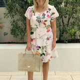 Jenna cascading floral tiered dress with flowing skirt in a soft feminine print
