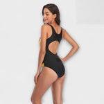Agnes sporty one-piece swimsuit with cut-out detail and diagonal slimming stripes