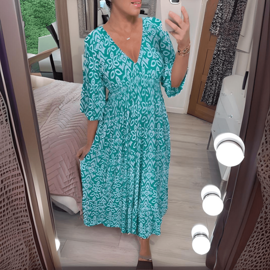 Amara boho chic printed dress in a bold flowing print, shown on a model