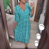Amara boho chic printed dress in a bold flowing print, shown on a model