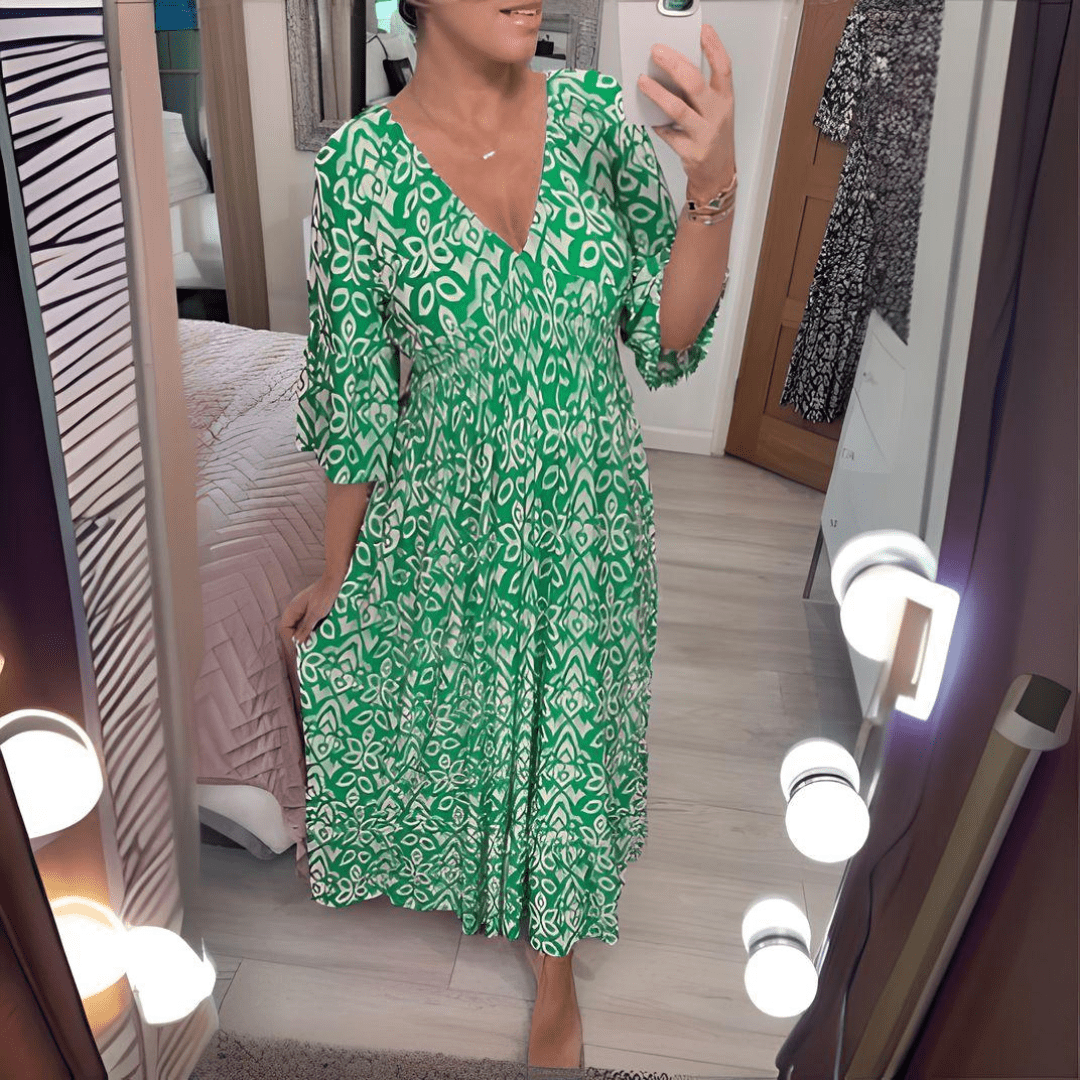 Amara boho chic printed dress in a bold flowing print, shown on a model