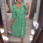 Amara boho chic printed dress in a bold flowing print, shown on a model