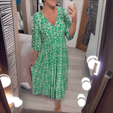 Amara boho chic printed dress in a bold flowing print, shown on a model