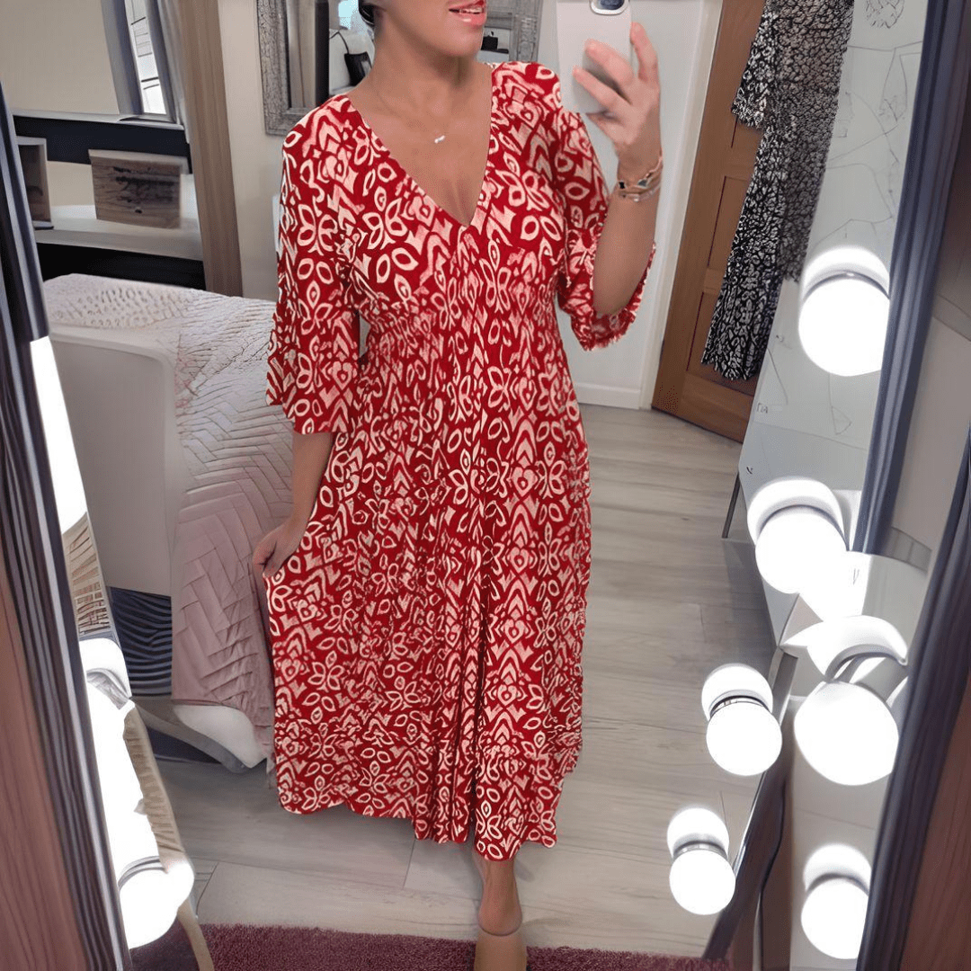 Amara boho chic printed dress in a bold flowing print, shown on a model