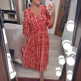 Amara boho chic printed dress in a bold flowing print, shown on a model