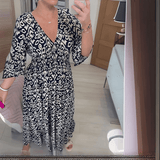 Amara boho chic printed dress in a bold flowing print, shown on a model