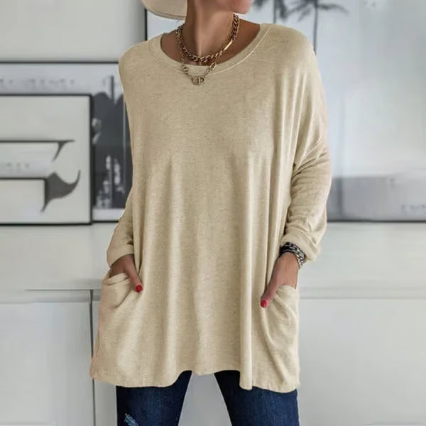 Alondra everyday pocket top with loose fit and flared hem, shown in a neutral colour
