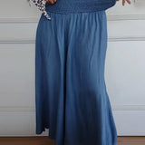 Sage flowy high-waist wide-leg pants shown in a relaxed, flattering silhouette