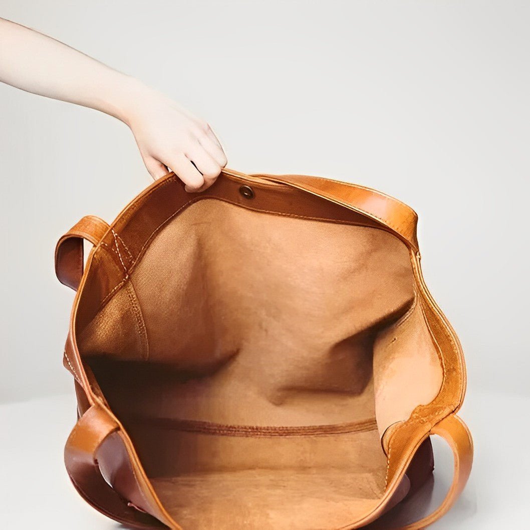 Sunset Luxe leather shoulder bag shown in brown, wine and black