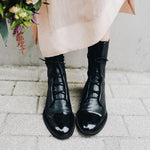 Andrea heeled boots shown in black and brown with a sleek modern silhouette