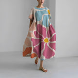 Celia floral Garden Goddess dress in a feminine print, shown in multiple colourways