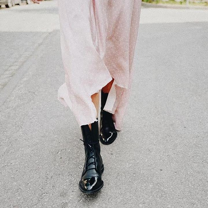 Andrea heeled boots shown in black and brown with a sleek modern silhouette