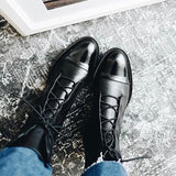 Andrea heeled boots shown in black and brown with a sleek modern silhouette