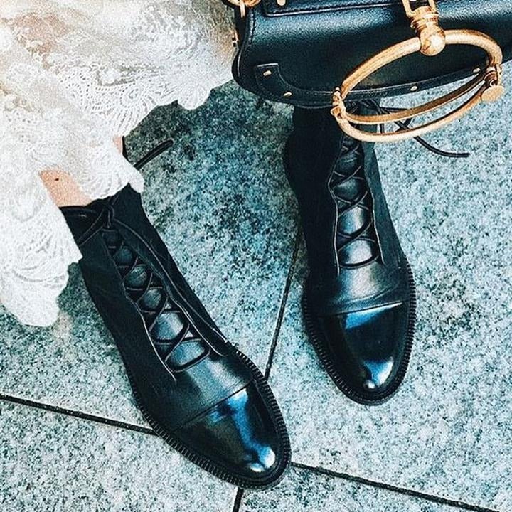 Andrea heeled boots shown in black and brown with a sleek modern silhouette