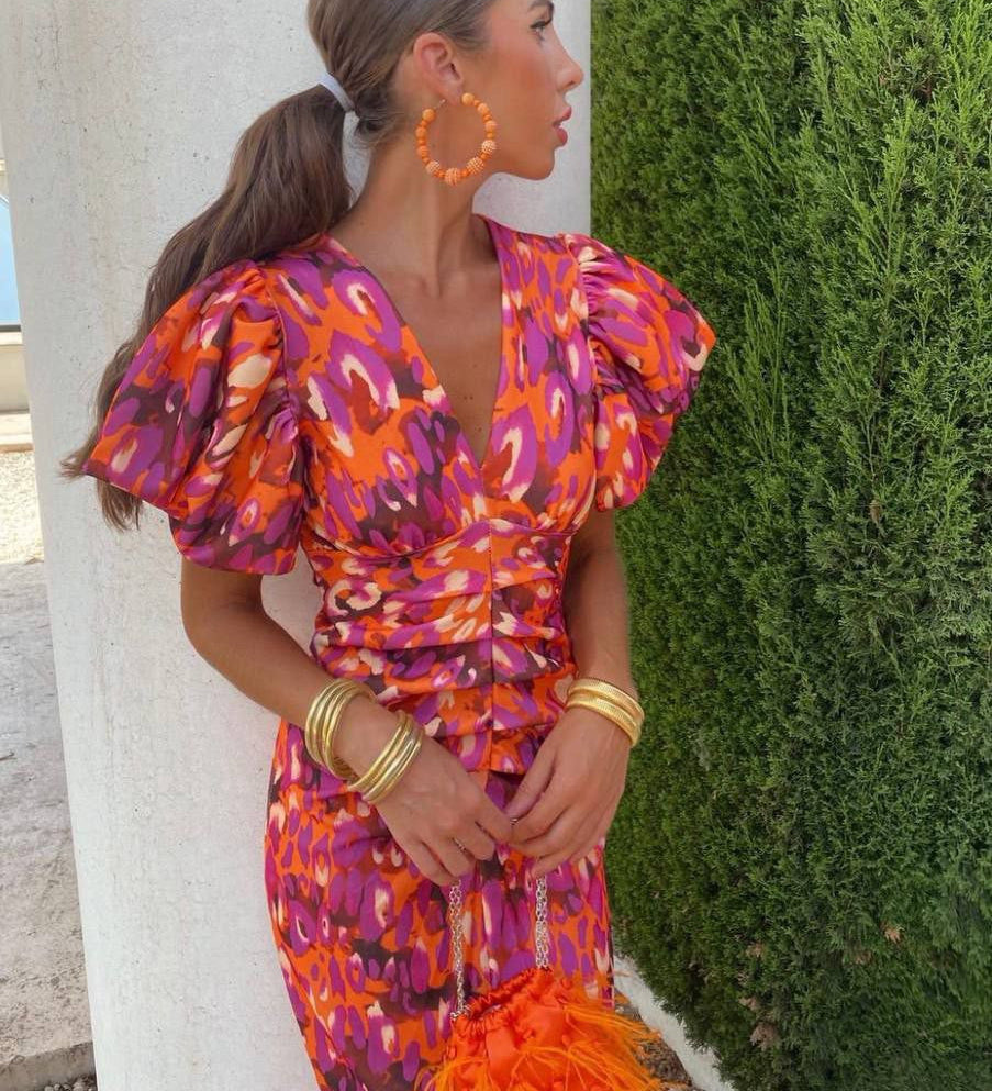 Giselle breezy floral midi dress with V-neckline and puff sleeves