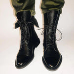 Andrea heeled boots shown in black and brown with a sleek modern silhouette