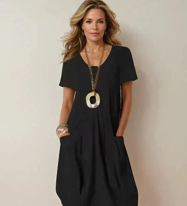 Kwani Easy Casual Flow Dress with round neck, classic sleeves and A-line silhouette