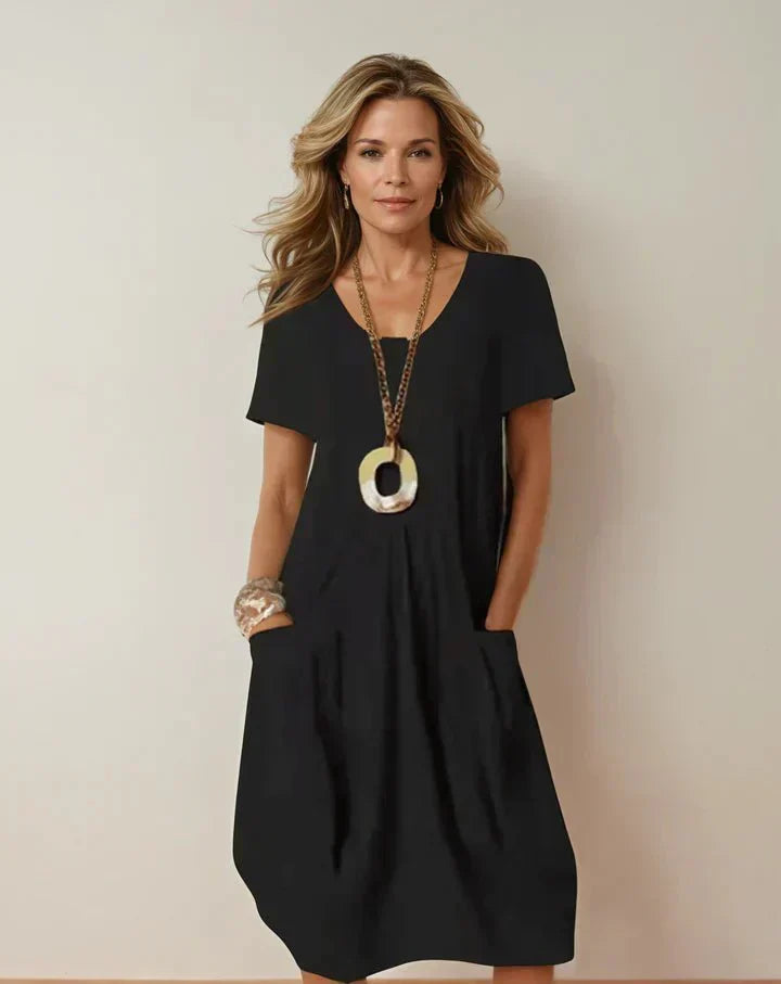 Kwani Easy Casual Flow Dress with round neck, classic sleeves and A-line silhouette
