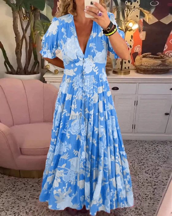 Izara flowy maxi dress with softly cinched elastic waist, shown in a relaxed feminine silhouette