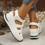 Isadora closed-toe sneaker sandals shown in carbon black and soft white
