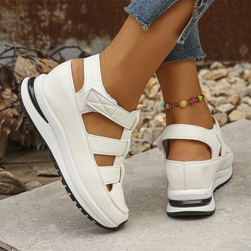 Isadora closed-toe sneaker sandals shown in carbon black and soft white