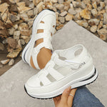 Isadora closed-toe sneaker sandals shown in carbon black and soft white