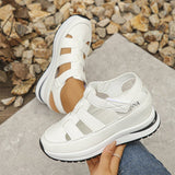 Isadora closed-toe sneaker sandals shown in carbon black and soft white