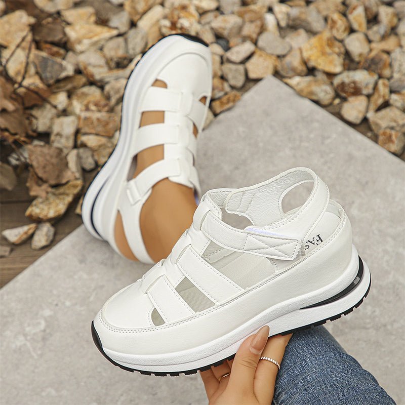 Isadora closed-toe sneaker sandals shown in carbon black and soft white