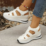 Isadora closed-toe sneaker sandals shown in carbon black and soft white