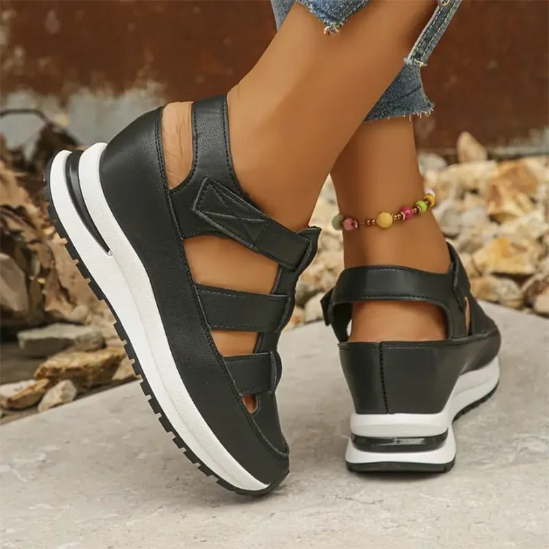 Isadora closed-toe sneaker sandals shown in carbon black and soft white