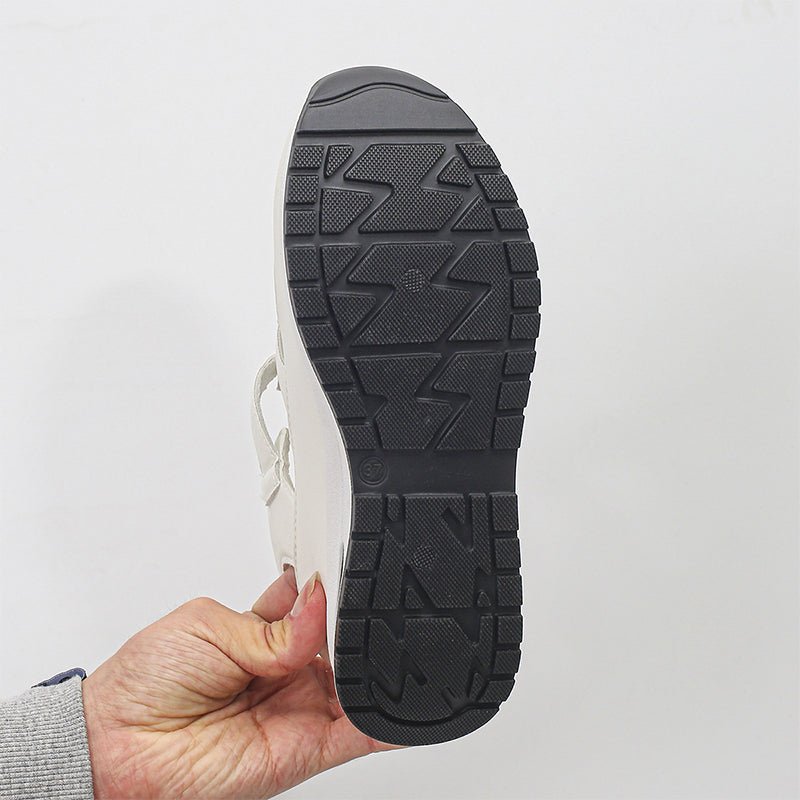 Isadora closed-toe sneaker sandals shown in carbon black and soft white
