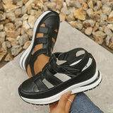 Isadora closed-toe sneaker sandals shown in carbon black and soft white