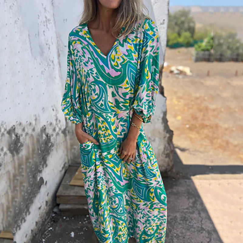 Hailey abstract print boho maxi dress with V-neckline and flowing silhouette