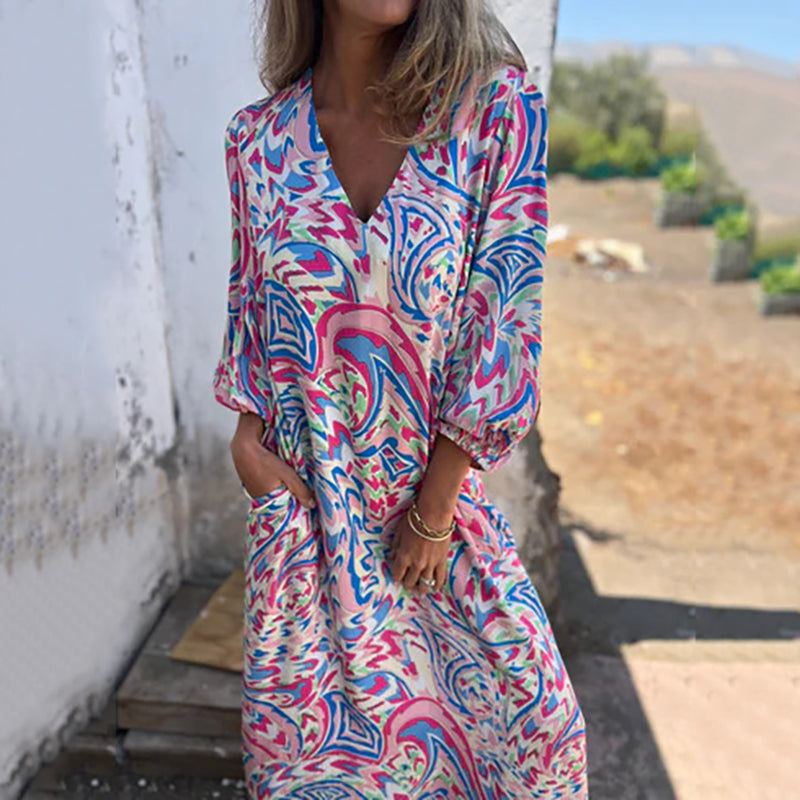 Hailey abstract print boho maxi dress with V-neckline and flowing silhouette