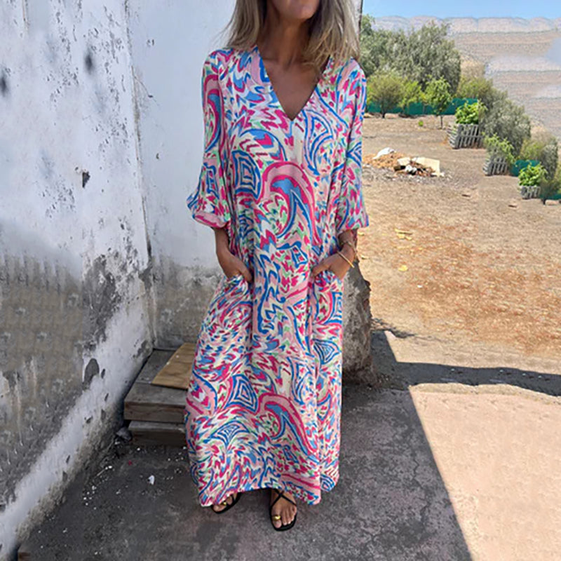 Hailey abstract print boho maxi dress with V-neckline and flowing silhouette