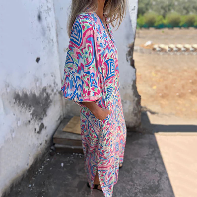 Hailey abstract print boho maxi dress with V-neckline and flowing silhouette