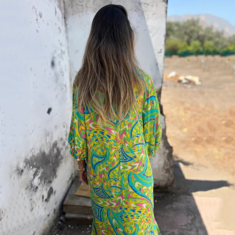 Hailey abstract print boho maxi dress with V-neckline and flowing silhouette