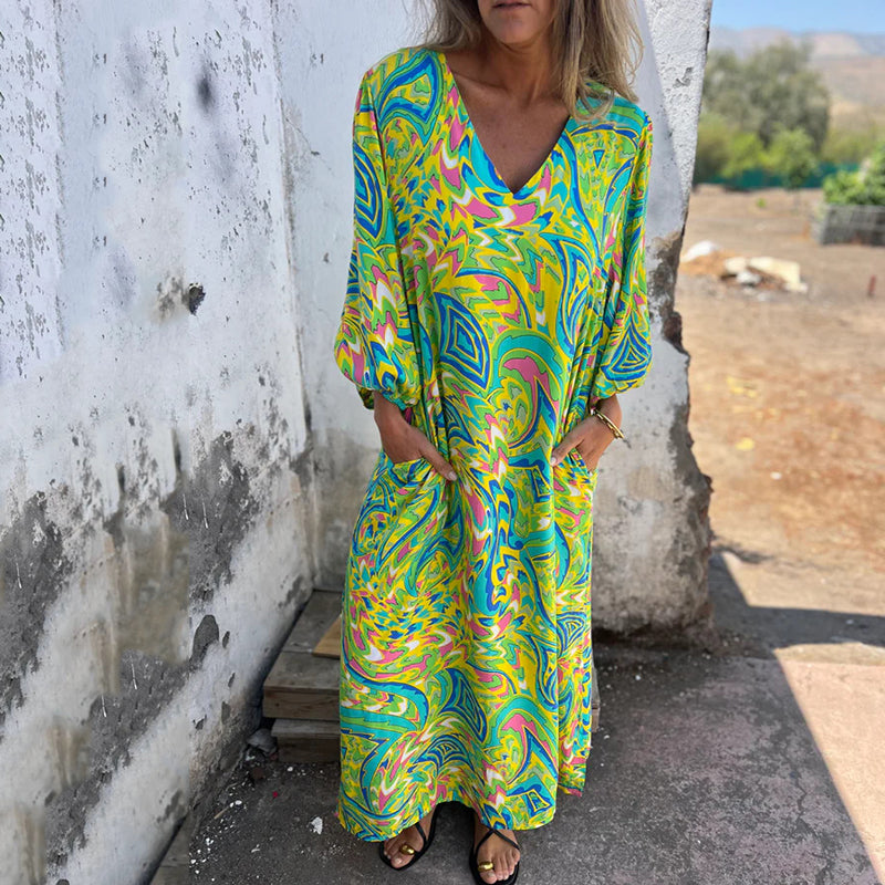 Hailey abstract print boho maxi dress with V-neckline and flowing silhouette